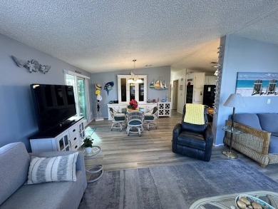 Lot Rent for this home is $1,342.00/monthly. Beautiful stucco on Del Tura Golf and Country Club in Florida - for sale on GolfHomes.com, golf home, golf lot