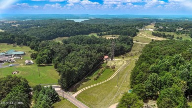 Nestled on 5 peaceful, wooded acres, this charming 2-bedroom on Wind River Golf Course in Tennessee - for sale on GolfHomes.com, golf home, golf lot