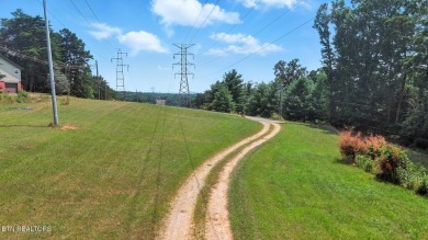 Nestled on 5 peaceful, wooded acres, this charming 2-bedroom on Wind River Golf Course in Tennessee - for sale on GolfHomes.com, golf home, golf lot