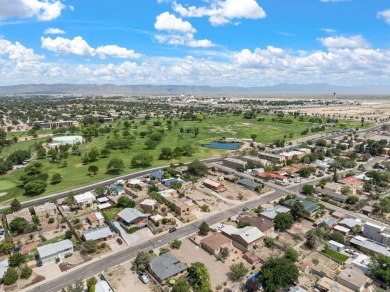 A wonderful opportunity to own a home in the UNM area with an on Puerto Del Sol Golf Course in New Mexico - for sale on GolfHomes.com, golf home, golf lot