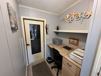 Lot Rent for this home is $1,342.00/monthly. Beautiful stucco on Del Tura Golf and Country Club in Florida - for sale on GolfHomes.com, golf home, golf lot