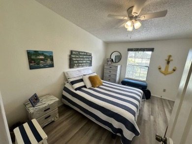 Lot Rent for this home is $1,342.00/monthly. Beautiful stucco on Del Tura Golf and Country Club in Florida - for sale on GolfHomes.com, golf home, golf lot