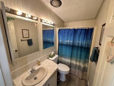 Lot Rent for this home is $1,342.00/monthly. Beautiful stucco on Del Tura Golf and Country Club in Florida - for sale on GolfHomes.com, golf home, golf lot