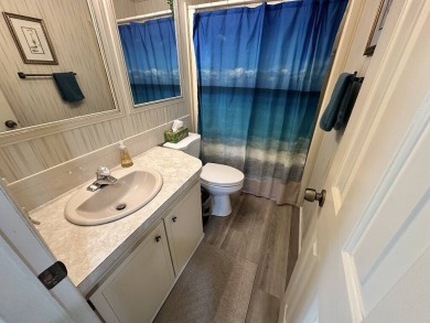 Lot Rent for this home is $1,342.00/monthly. Beautiful stucco on Del Tura Golf and Country Club in Florida - for sale on GolfHomes.com, golf home, golf lot