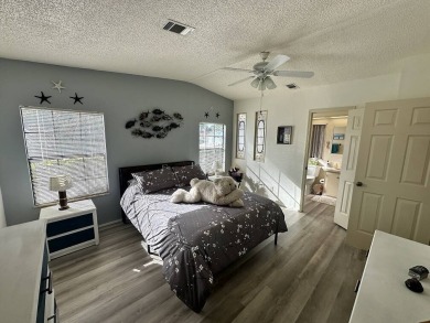 Lot Rent for this home is $1,342.00/monthly. Beautiful stucco on Del Tura Golf and Country Club in Florida - for sale on GolfHomes.com, golf home, golf lot