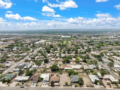 A wonderful opportunity to own a home in the UNM area with an on Puerto Del Sol Golf Course in New Mexico - for sale on GolfHomes.com, golf home, golf lot