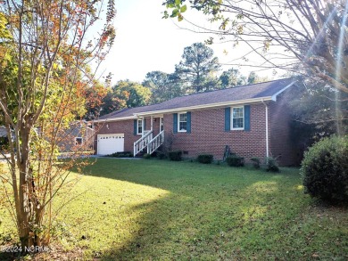 Inviting 3-Bedroom Brick Home with Sunroom Backing to the River on River Bend Golf and Country Club in North Carolina - for sale on GolfHomes.com, golf home, golf lot