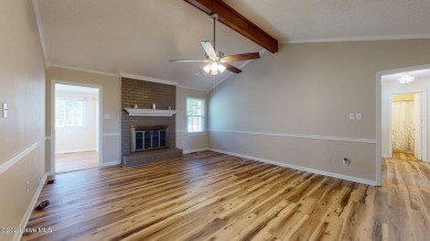 Inviting 3-Bedroom Brick Home with Sunroom Backing to the River on River Bend Golf and Country Club in North Carolina - for sale on GolfHomes.com, golf home, golf lot