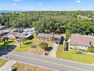 Discover an incredible opportunity to own a 4-bedroom brick home on Tiger Point Golf and Country Club in Florida - for sale on GolfHomes.com, golf home, golf lot