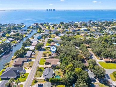 Discover an incredible opportunity to own a 4-bedroom brick home on Tiger Point Golf and Country Club in Florida - for sale on GolfHomes.com, golf home, golf lot