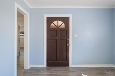 Discover an incredible opportunity to own a 4-bedroom brick home on Tiger Point Golf and Country Club in Florida - for sale on GolfHomes.com, golf home, golf lot