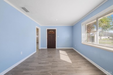Discover an incredible opportunity to own a 4-bedroom brick home on Tiger Point Golf and Country Club in Florida - for sale on GolfHomes.com, golf home, golf lot