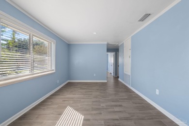 Discover an incredible opportunity to own a 4-bedroom brick home on Tiger Point Golf and Country Club in Florida - for sale on GolfHomes.com, golf home, golf lot