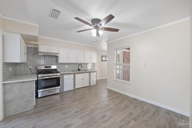 Discover an incredible opportunity to own a 4-bedroom brick home on Tiger Point Golf and Country Club in Florida - for sale on GolfHomes.com, golf home, golf lot