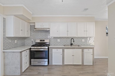 Discover an incredible opportunity to own a 4-bedroom brick home on Tiger Point Golf and Country Club in Florida - for sale on GolfHomes.com, golf home, golf lot