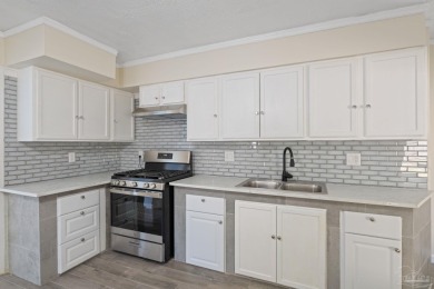 Discover an incredible opportunity to own a 4-bedroom brick home on Tiger Point Golf and Country Club in Florida - for sale on GolfHomes.com, golf home, golf lot