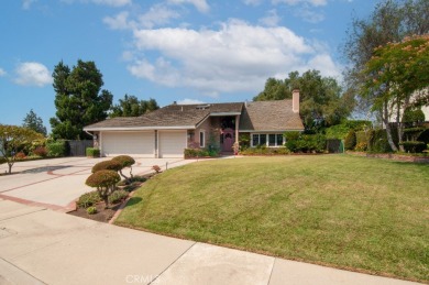 Step inside to find two expansive living areas, a large kitchen on Friendly Hills Country Club in California - for sale on GolfHomes.com, golf home, golf lot
