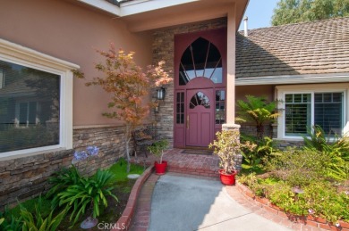 Step inside to find two expansive living areas, a large kitchen on Friendly Hills Country Club in California - for sale on GolfHomes.com, golf home, golf lot