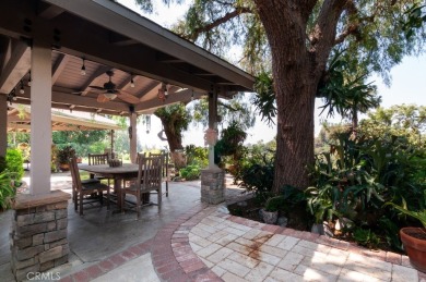 Step inside to find two expansive living areas, a large kitchen on Friendly Hills Country Club in California - for sale on GolfHomes.com, golf home, golf lot