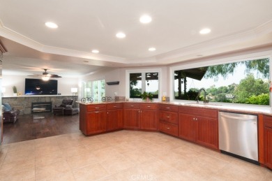 Step inside to find two expansive living areas, a large kitchen on Friendly Hills Country Club in California - for sale on GolfHomes.com, golf home, golf lot