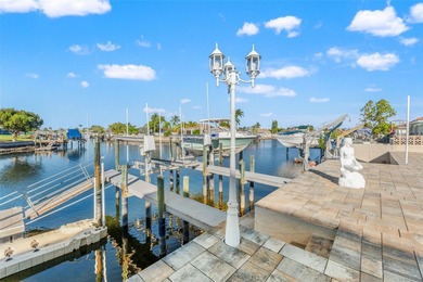 Wake up every morning to shimmering canal views, step out onto on Gulf Harbors Golf Course in Florida - for sale on GolfHomes.com, golf home, golf lot