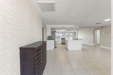 This beautifully updated Gulf Harbors waterfront home delivers on Gulf Harbors Golf Course in Florida - for sale on GolfHomes.com, golf home, golf lot