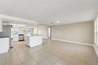 This beautifully updated Gulf Harbors waterfront home delivers on Gulf Harbors Golf Course in Florida - for sale on GolfHomes.com, golf home, golf lot