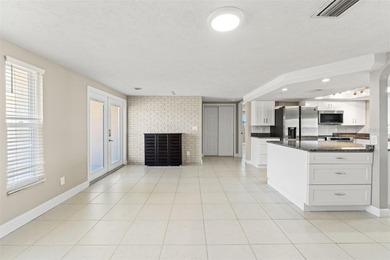 This beautifully updated Gulf Harbors waterfront home delivers on Gulf Harbors Golf Course in Florida - for sale on GolfHomes.com, golf home, golf lot