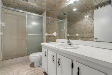 You're invited to this 2/2 corner unit with large windows on Inverrary Country Club in Florida - for sale on GolfHomes.com, golf home, golf lot