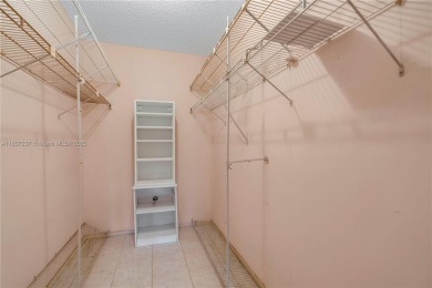You're invited to this 2/2 corner unit with large windows on Inverrary Country Club in Florida - for sale on GolfHomes.com, golf home, golf lot