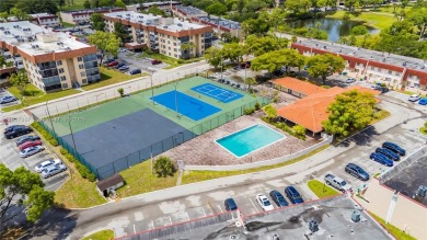 You're invited to this 2/2 corner unit with large windows on Inverrary Country Club in Florida - for sale on GolfHomes.com, golf home, golf lot