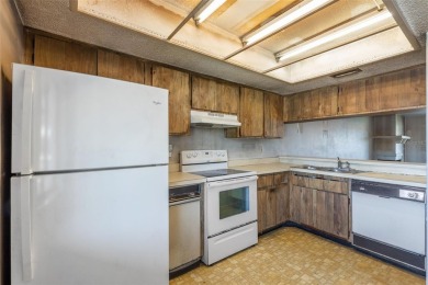 This second-floor, two-bedroom, two-bathroom condominium in East on East Lake Woodlands Country Club in Florida - for sale on GolfHomes.com, golf home, golf lot