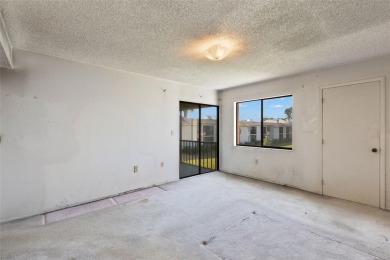 This second-floor, two-bedroom, two-bathroom condominium in East on East Lake Woodlands Country Club in Florida - for sale on GolfHomes.com, golf home, golf lot