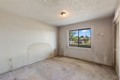 This second-floor, two-bedroom, two-bathroom condominium in East on East Lake Woodlands Country Club in Florida - for sale on GolfHomes.com, golf home, golf lot