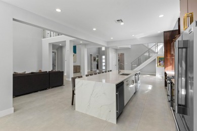 Step into this exquisitely renovated home, where modern design on Polo Club of Boca Raton in Florida - for sale on GolfHomes.com, golf home, golf lot