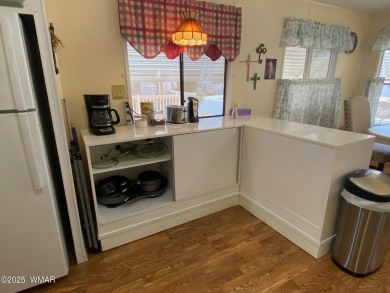 This cozy park model features 2 full bathrooms, a 40 gal hot on Juniper Ridge R.V. Golf Resort in Arizona - for sale on GolfHomes.com, golf home, golf lot