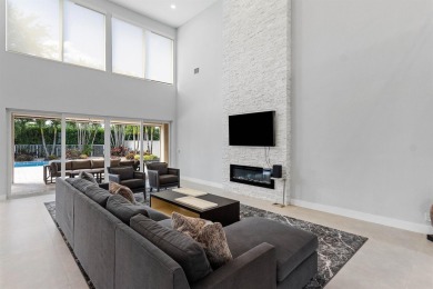 Step into this exquisitely renovated home, where modern design on Polo Club of Boca Raton in Florida - for sale on GolfHomes.com, golf home, golf lot