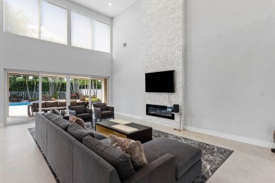 Step into this exquisitely renovated home, where modern design on Polo Club of Boca Raton in Florida - for sale on GolfHomes.com, golf home, golf lot