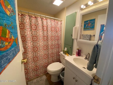 This cozy park model features 2 full bathrooms, a 40 gal hot on Juniper Ridge R.V. Golf Resort in Arizona - for sale on GolfHomes.com, golf home, golf lot