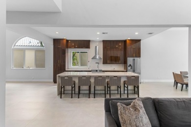 Step into this exquisitely renovated home, where modern design on Polo Club of Boca Raton in Florida - for sale on GolfHomes.com, golf home, golf lot