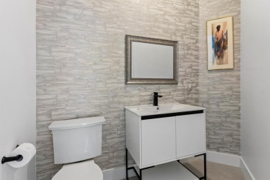 Step into this exquisitely renovated home, where modern design on Polo Club of Boca Raton in Florida - for sale on GolfHomes.com, golf home, golf lot