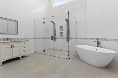 Step into this exquisitely renovated home, where modern design on Polo Club of Boca Raton in Florida - for sale on GolfHomes.com, golf home, golf lot