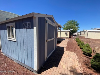 This cozy park model features 2 full bathrooms, a 40 gal hot on Juniper Ridge R.V. Golf Resort in Arizona - for sale on GolfHomes.com, golf home, golf lot
