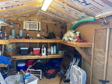 This cozy park model features 2 full bathrooms, a 40 gal hot on Juniper Ridge R.V. Golf Resort in Arizona - for sale on GolfHomes.com, golf home, golf lot