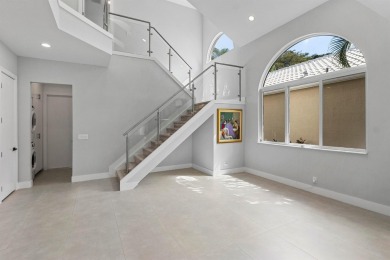 Step into this exquisitely renovated home, where modern design on Polo Club of Boca Raton in Florida - for sale on GolfHomes.com, golf home, golf lot