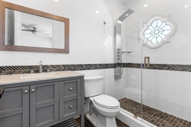 Step into this exquisitely renovated home, where modern design on Polo Club of Boca Raton in Florida - for sale on GolfHomes.com, golf home, golf lot