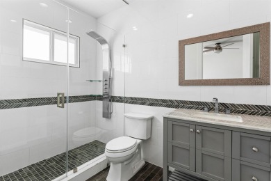Step into this exquisitely renovated home, where modern design on Polo Club of Boca Raton in Florida - for sale on GolfHomes.com, golf home, golf lot