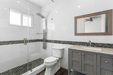 Step into this exquisitely renovated home, where modern design on Polo Club of Boca Raton in Florida - for sale on GolfHomes.com, golf home, golf lot