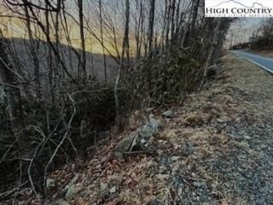 This buildable third acre lot is located close to Buckeye Lake on Beech Mountain Club in North Carolina - for sale on GolfHomes.com, golf home, golf lot