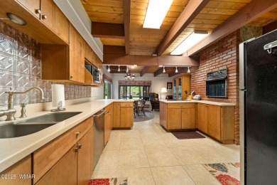 Set on a beautiful 0.52-acre lot surrounded by towering pines on Pinetop Lakes Country Club in Arizona - for sale on GolfHomes.com, golf home, golf lot